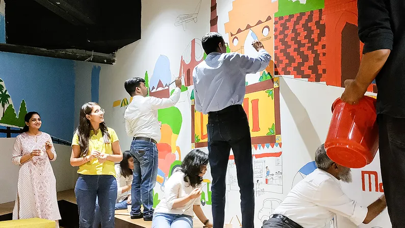 350+ sq. ft. mural created for Mahindra Logistics, inspired by inclusion and collaborative creativity.